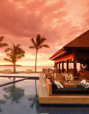 Sunset drinks by the resort pool.