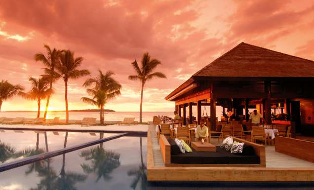 Sunset drinks by the resort pool.