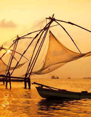Sunset over Chinese fishing nets in Fort Kochi India.