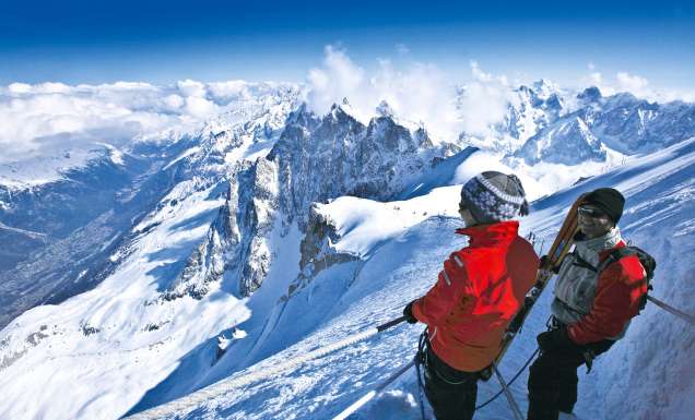 Skiers enjoying the view from Mont Blanc, France.