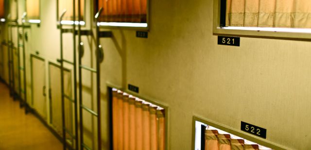 Small bedroom pods are stacked on eachother at Asakusa Hotel and Capsule, Japan