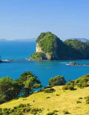 Coromandel town and its bay of green and blue hues, dotted with islands and capes.