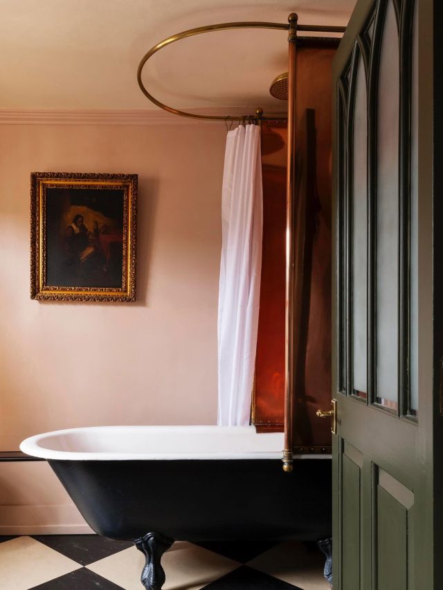 a bathtub inside a suite at Hazlitt's London