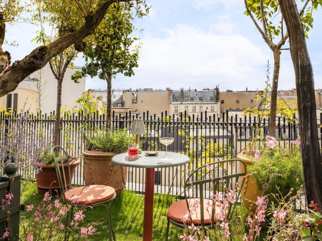 lush courtyard garden and rooftop bar at La Fantaisie