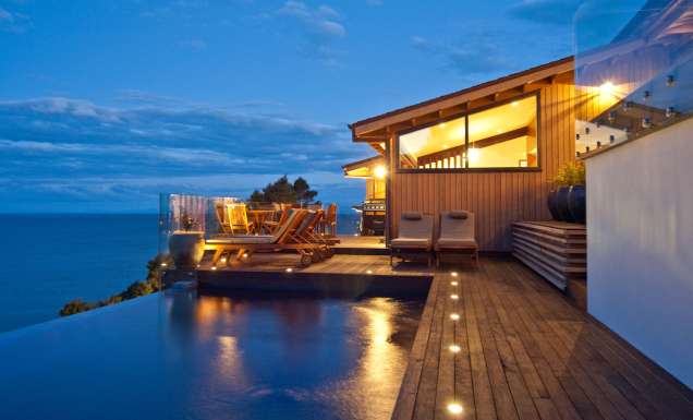 Split Apple Retreat - set high on a cliff-face on the seaside border of Abel Tasman National Park, on New Zealand’s South Island.