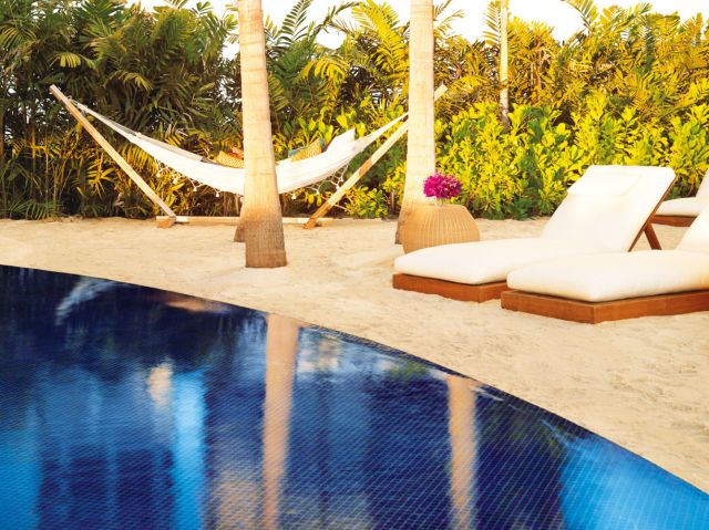 The Sunset Pool's hammocks are only steps from a tiki-luxe bar.