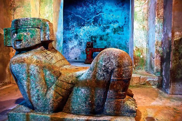 Ancient figures stand guard inside the pyramid of Chichen Itza.
