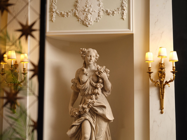 a statue of a woman the the foyer of The Savoy Hotel London