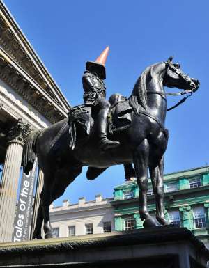 Duke of Wellington statue sporting a traffic cone.