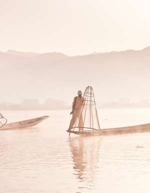 First light hits Inle Lake and the cone-fishermen start their working day.