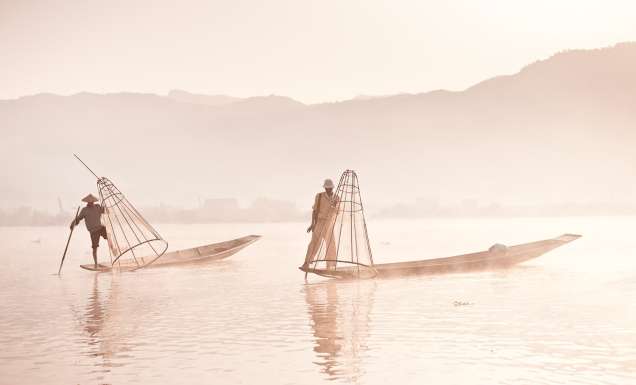 First light hits Inle Lake and the cone-fishermen start their working day.