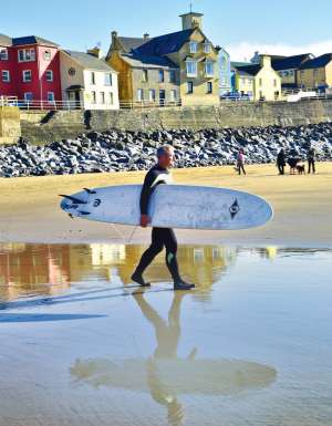 American surfer Shawn Hickey heading out for one of his first rides in Ireland at Lahinch.