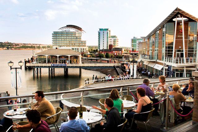 Mermaid Quay restaurants at dusk, overlooking Cardiff Bay.