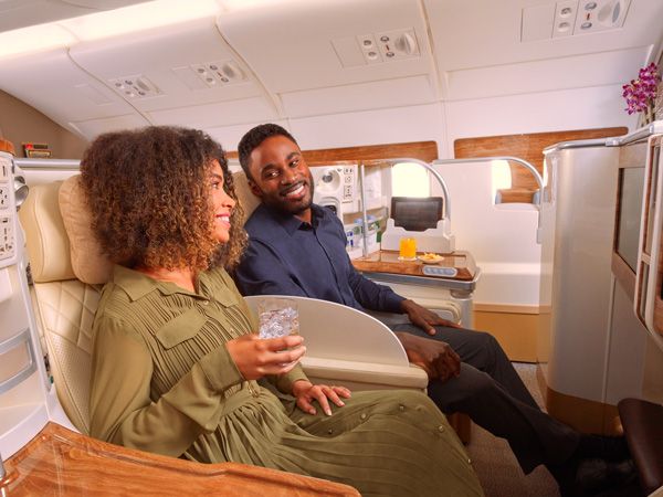a couple sitting next to each other onboard Emirates A380 Sydney – Dubai Business Class