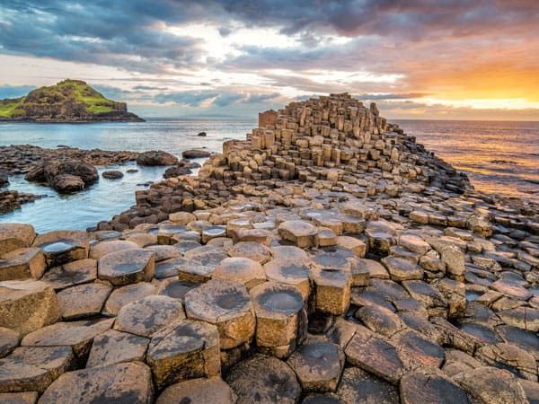 A dramatic sunset at the Giant's Causeway in Northern Ireland.