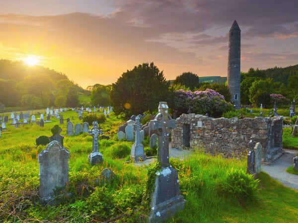 The round tower and the cemetery at the Glendalough monastic site in Country Wicklow, Ireland