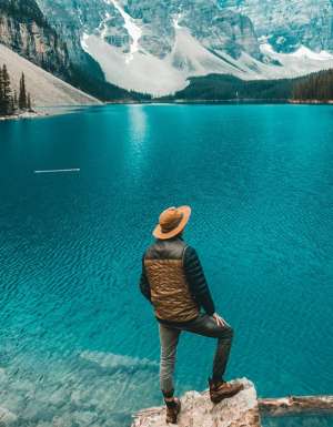 Man stands beside Moraine Lake