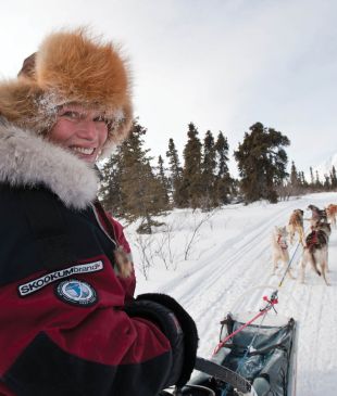 Experience the thrill of a dog sled ride across Yukon’s frozen lakes