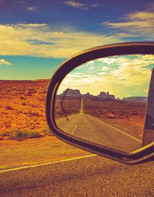 Reflection of road in car side mirror