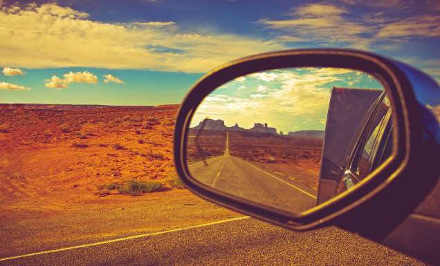 Reflection of road in car side mirror