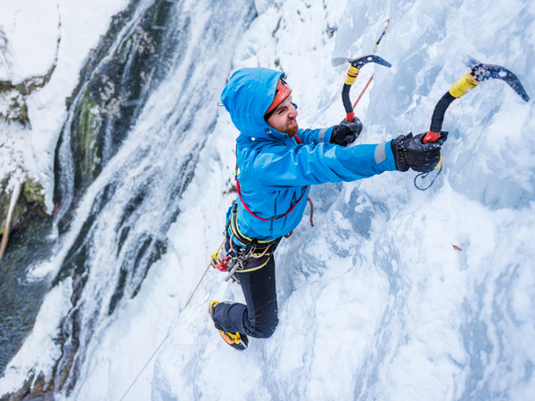Brave climber facing an extreme ice terrain