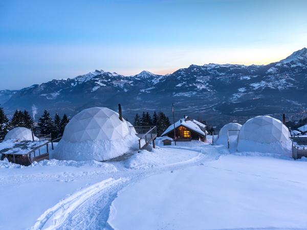 Morning shot of igloos on a snowy mountain