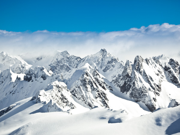 view over misty mountains from mount titlis, engelberg, switzerland. 3200m above sea level.