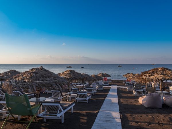 Day beds on Perivolos Beach, Santorini