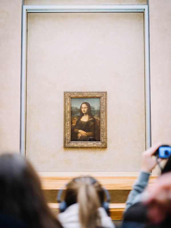 Mona Lisa amongst the crowd in the Louvre, Paris