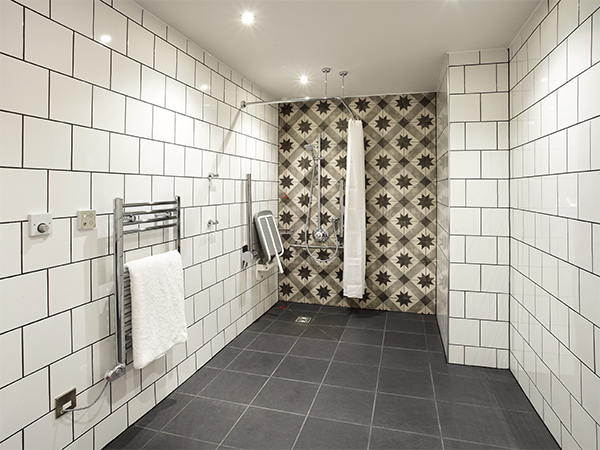 The bathroom reflects the bold design of the hotel