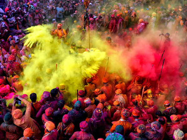 People celebrating in colour at the Holi Festival