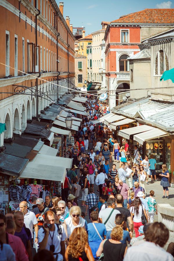Tourists overcrowding the streets of Venice.