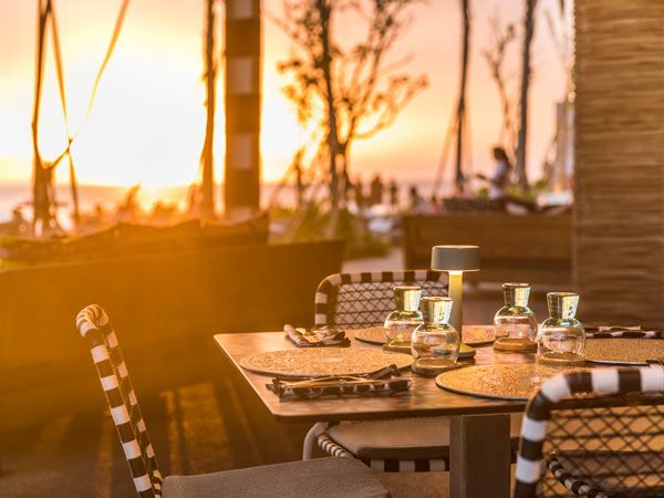 Enjoy a sundowner at COMO Beach Club