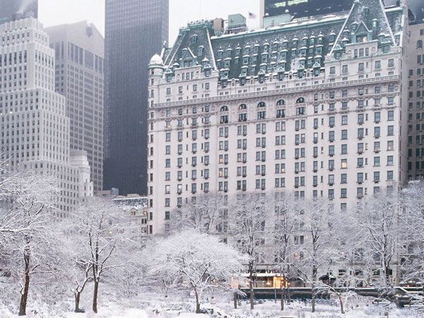 Exterior of The Plaza New York in snow at Christmas