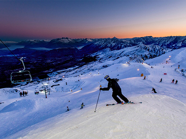 Skiing downhill at Coronet Peak in Queenstown