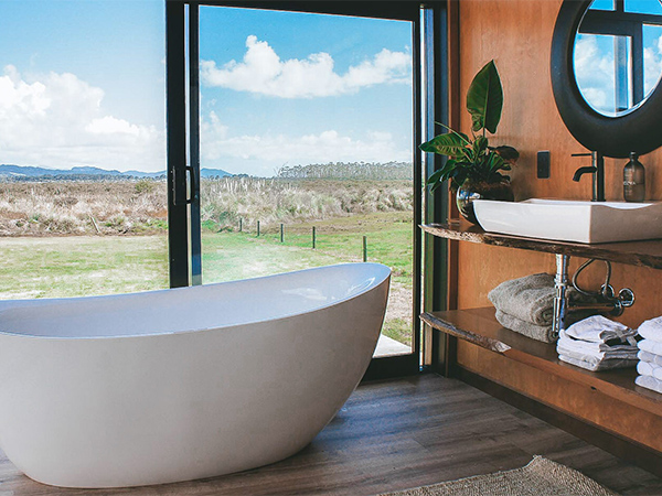 The bath and view at Coromandel Luxury Escapes.
