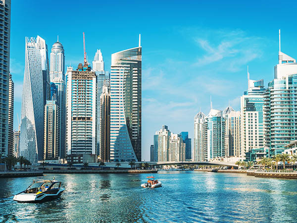 Panorama of Dubai Marina in UAE, modern skyscrapers and port with luxury yachts