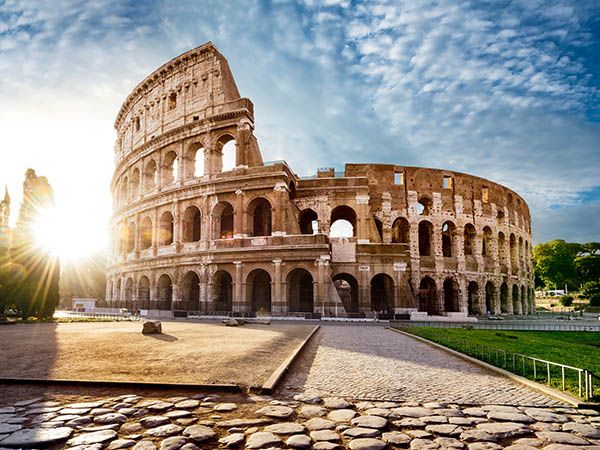 Colosseum in Rome and morning sun, Italy