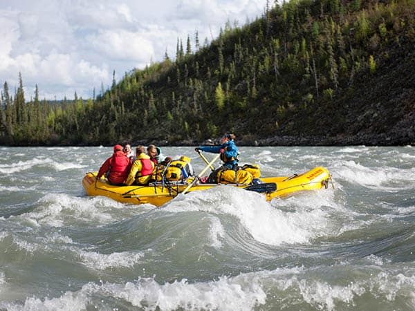 Guests in rafts through rapid waters, Nahanni River, Canada