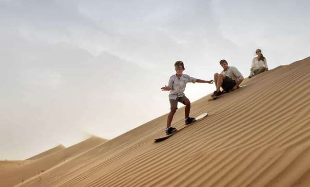 Family with child, Sandboarding in Dubai