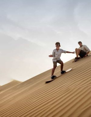 Family with child, Sandboarding in Dubai