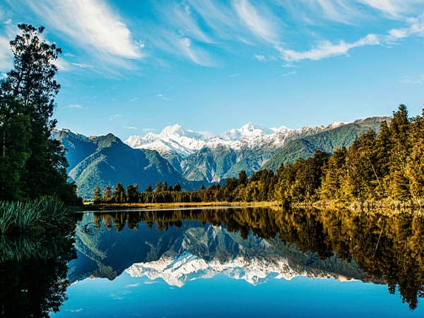 Reflections of Mount Cook and Mount Tasman in Lake Matheson, Fox Glacier New Zealand