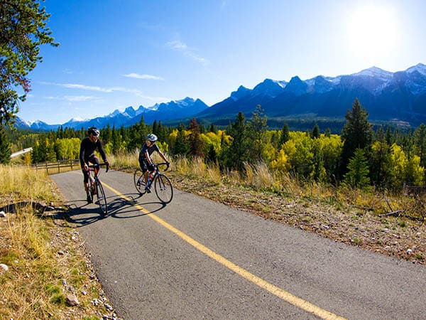 Riding road bicycles on the Legacy Trail in Banff National Park, Alberta, Canada.