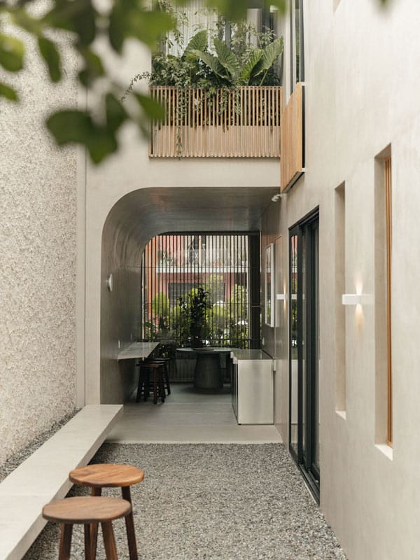 The Octavia Casa accommodation's courtyard with stools and pebbles in the Condesa neighbourhood.