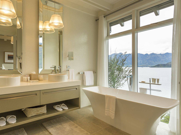 A bathroom that looks out into Lake Wakatipu. (Image: Matakauri Lodge)