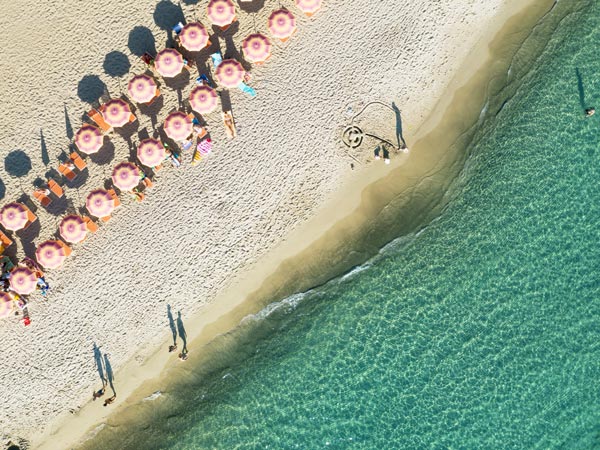 Aerial view of beach in Italy with parasols