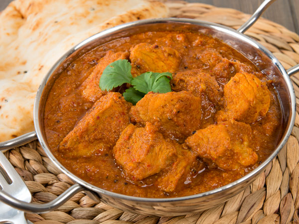 Pork Vindaloo from Goa with naan bread.