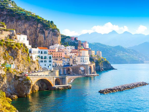Morning view of Amalfi cityscape on coast line of mediterranean sea, Italy