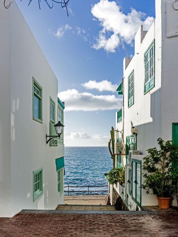 View along a narrow street in Playa Blanca, Lanzarote, Spain.