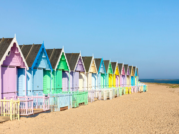 Rainbow houses in Mersea Island, Essex, England